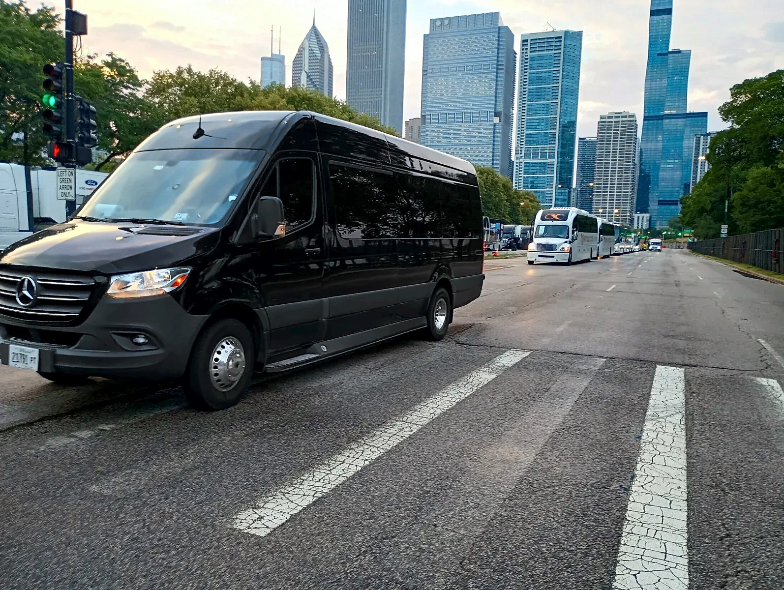 Black Mercedes Sprinter on Columbus Drive with the Chicago skyline