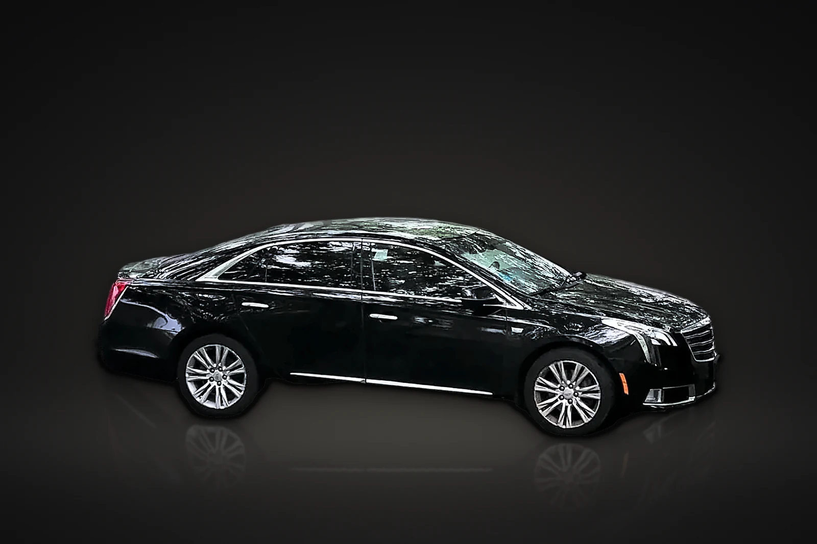Black Cadillac executive sedan in side profile